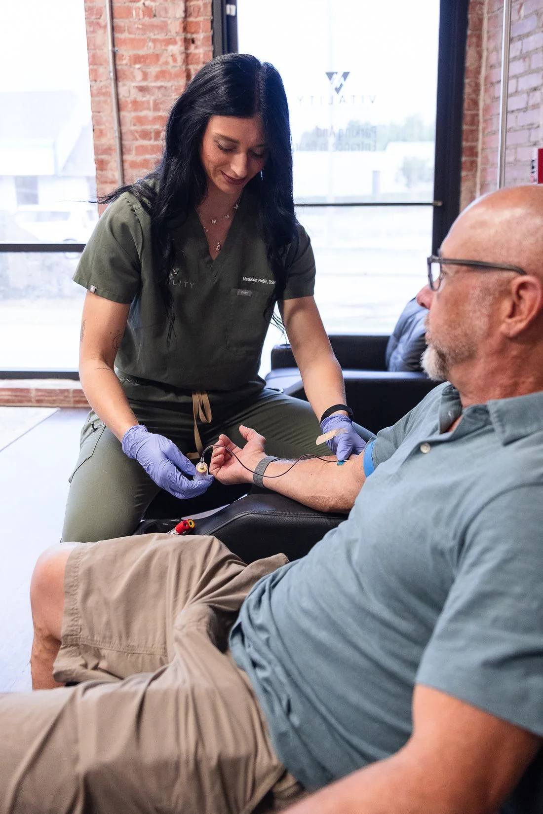 Vitality nurse drawing labs for a patient