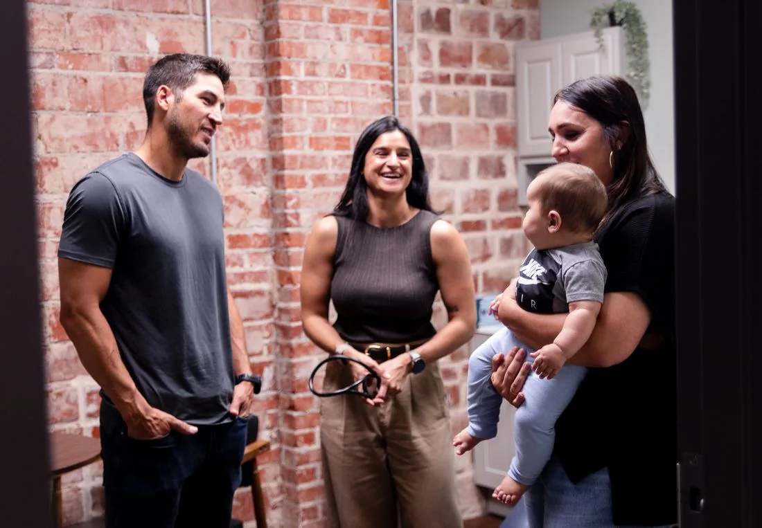 Vitality Functional Family Medicine team greeting a patient family