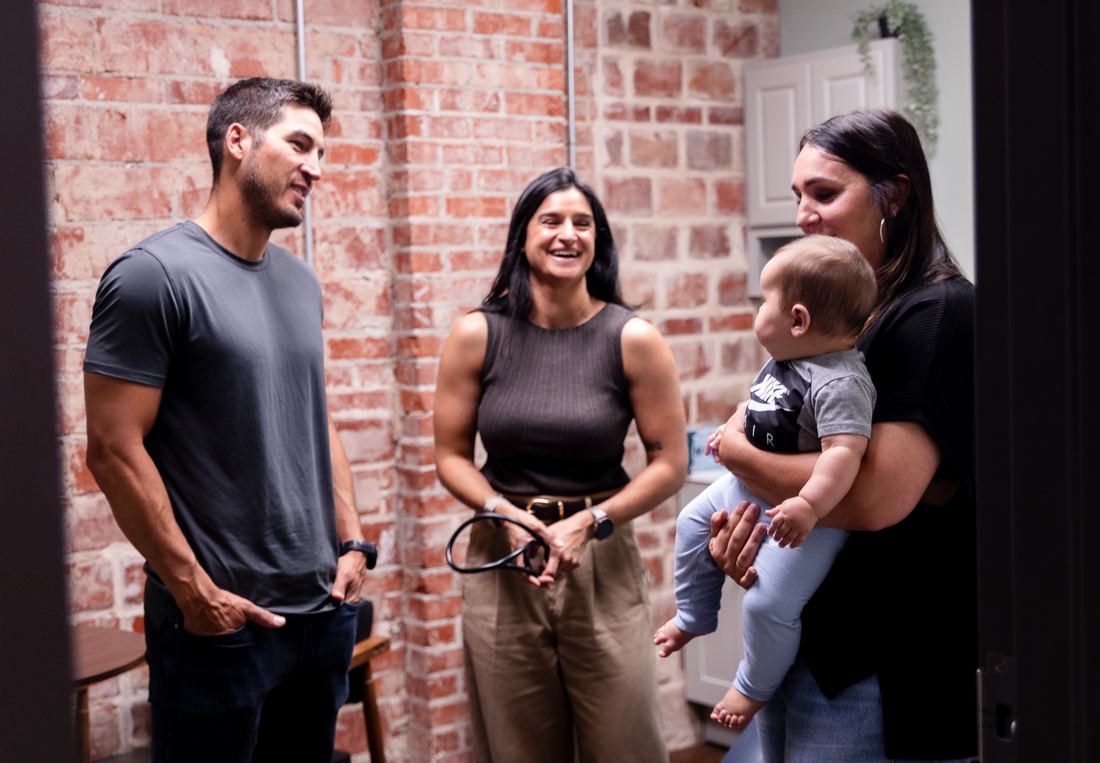 Vitality Functional Family Medicine team greeting a patient family