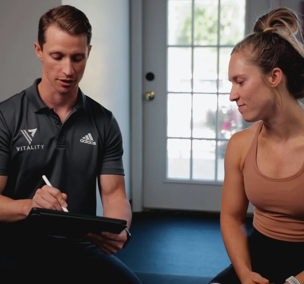 Hands-on hip mobility treatment at Vitality Therapy and Performance