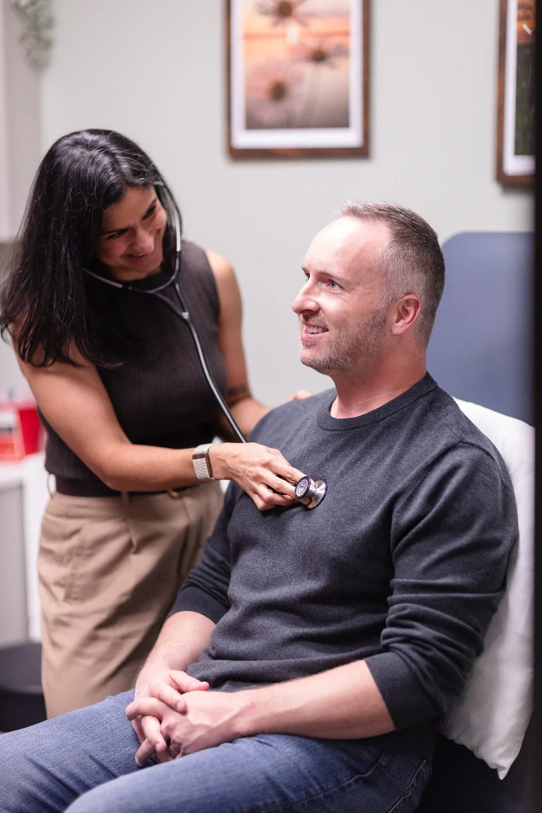 Dr. Amrit Dockery examining a patient at Vitality Functional Family Medicine