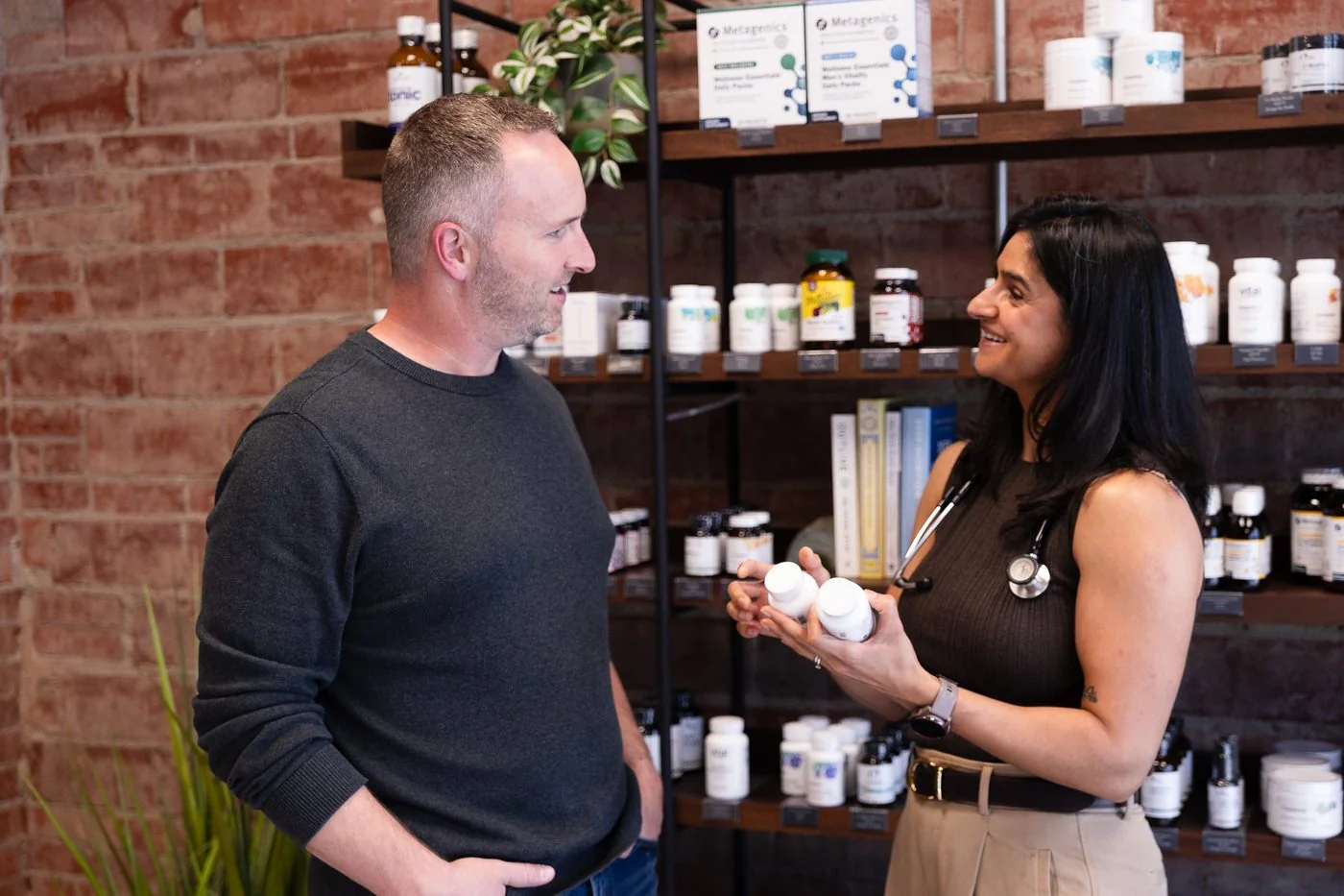 A Vitality provider reviewing supplements with a patient