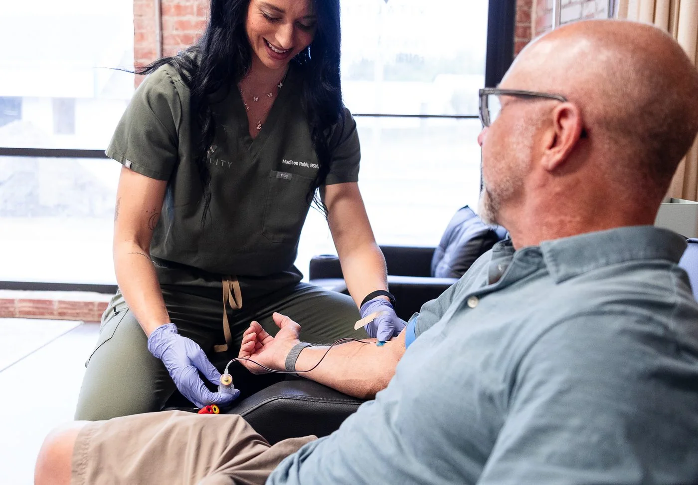 Vitality Functional Family Medicine clinician drawing labs from a patient